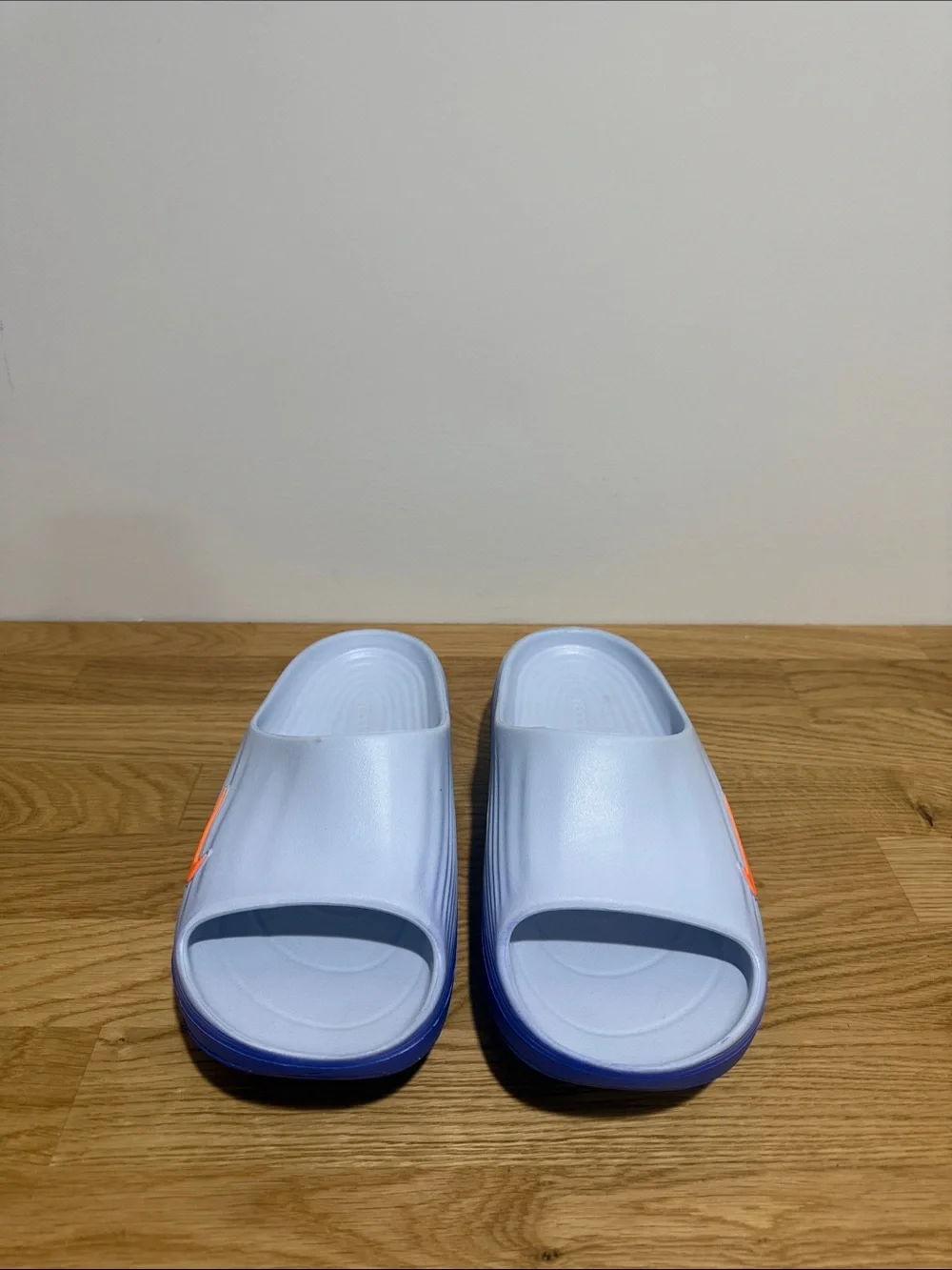 Brand new men’s size 9 Nike Rejuven8 Light Blue Slide Sandals with Orange Swoosh